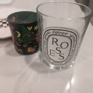 two empty RARE diptyque candles: ROSES and CHRISTMAS